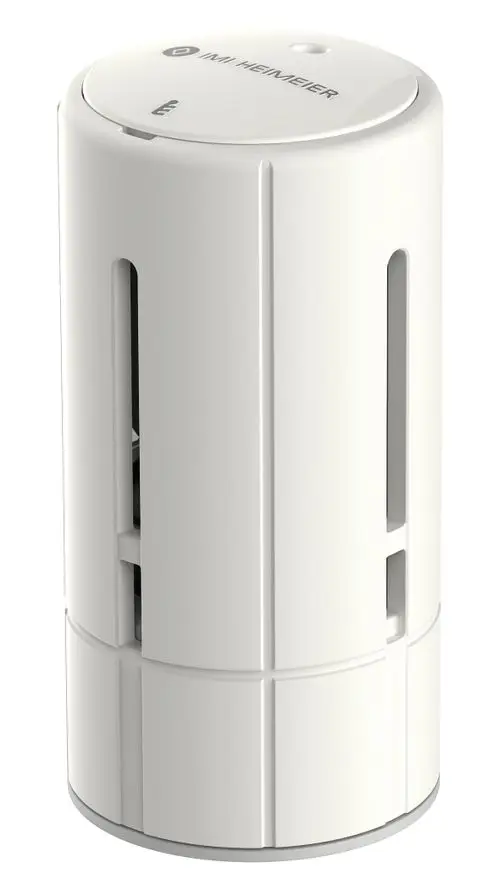 Weißer Thermostatkopf mit integriertem Sensor, hergestellt von IMI Hydronic Engineering. Zylindrische Form mit schmalen Schlitzen für Luftzirkulation.